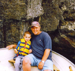 tyleranddaddyinboat.jpg